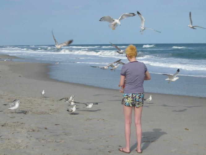 Val feeding many birds.JPG