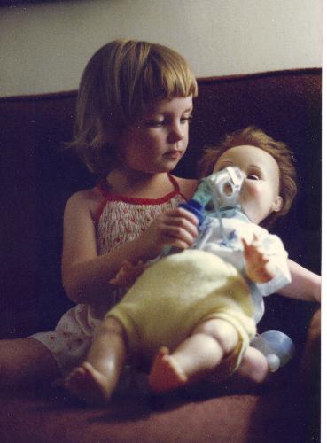 Val giving doll aerosol.jpg